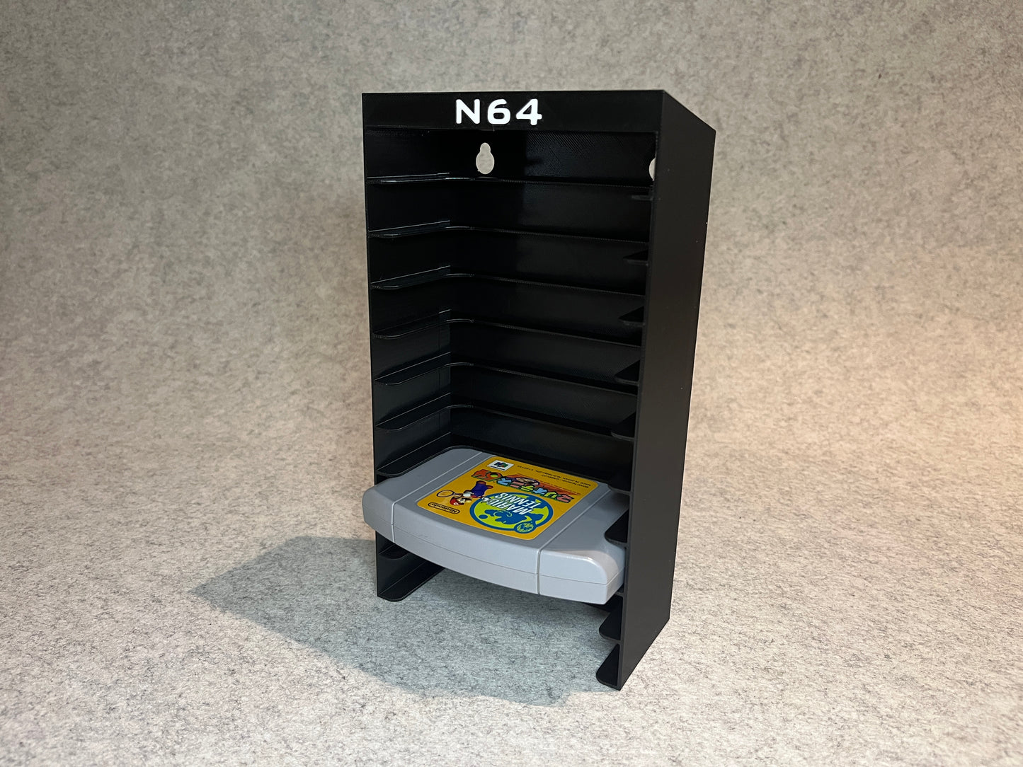 Vägghållare / spelställ för 10 spel till Nintendo 64 (N64)