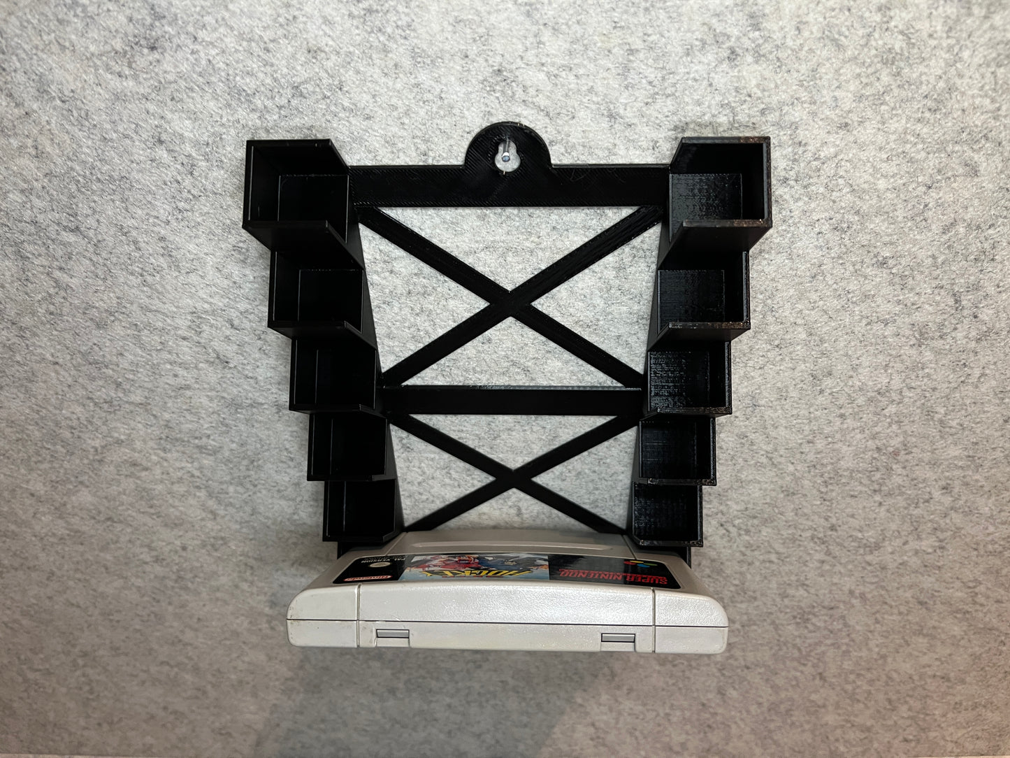 Vägghållare / spelställ för 6 spel till Super Nintendo SNES