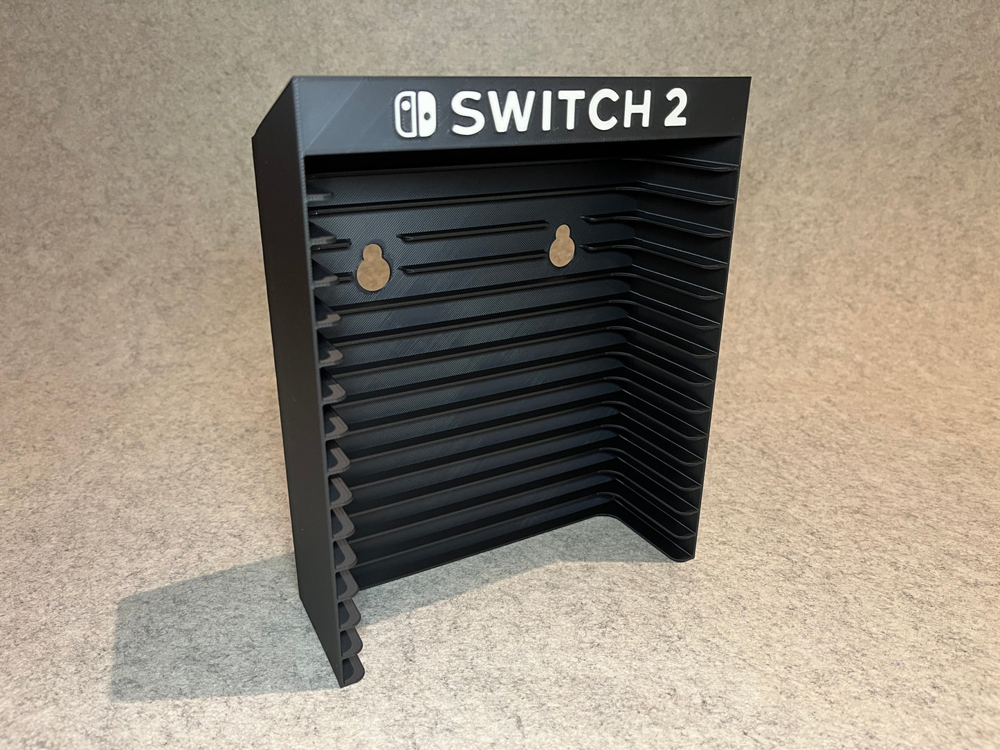 Vägghållare / spelställ för 12 spel till Nintendo Switch 2