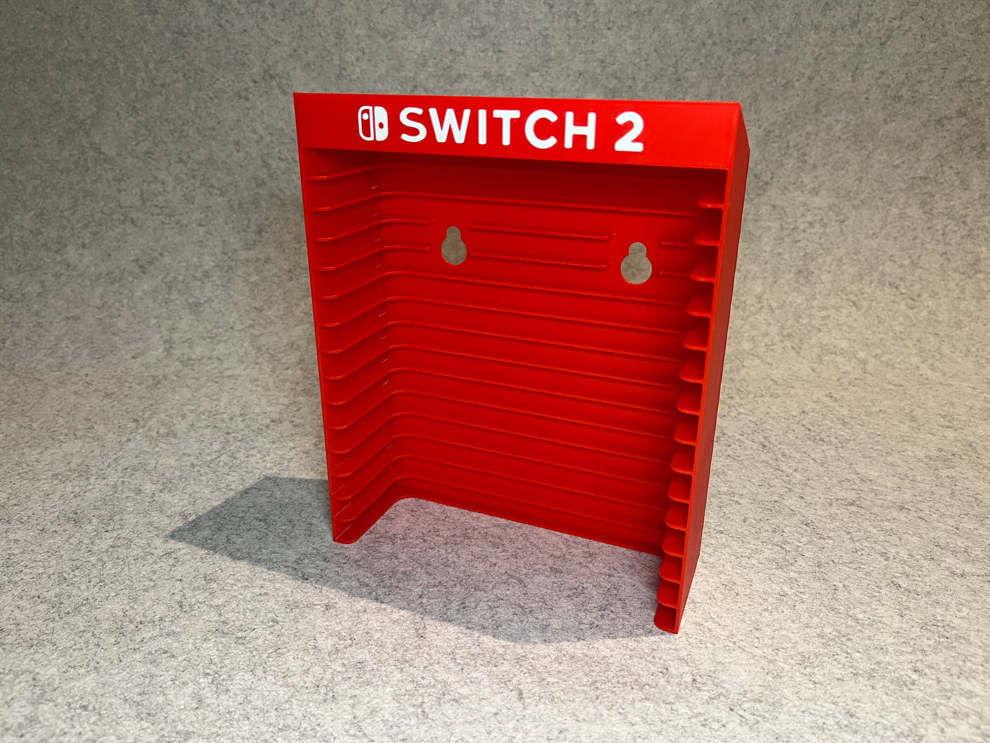 Vägghållare / spelställ för 12 spel till Nintendo Switch 2