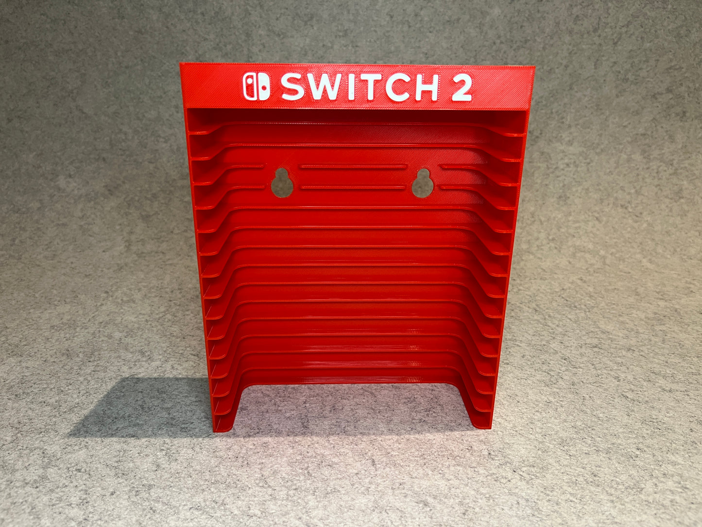 Vägghållare / spelställ för 12 spel till Nintendo Switch 2