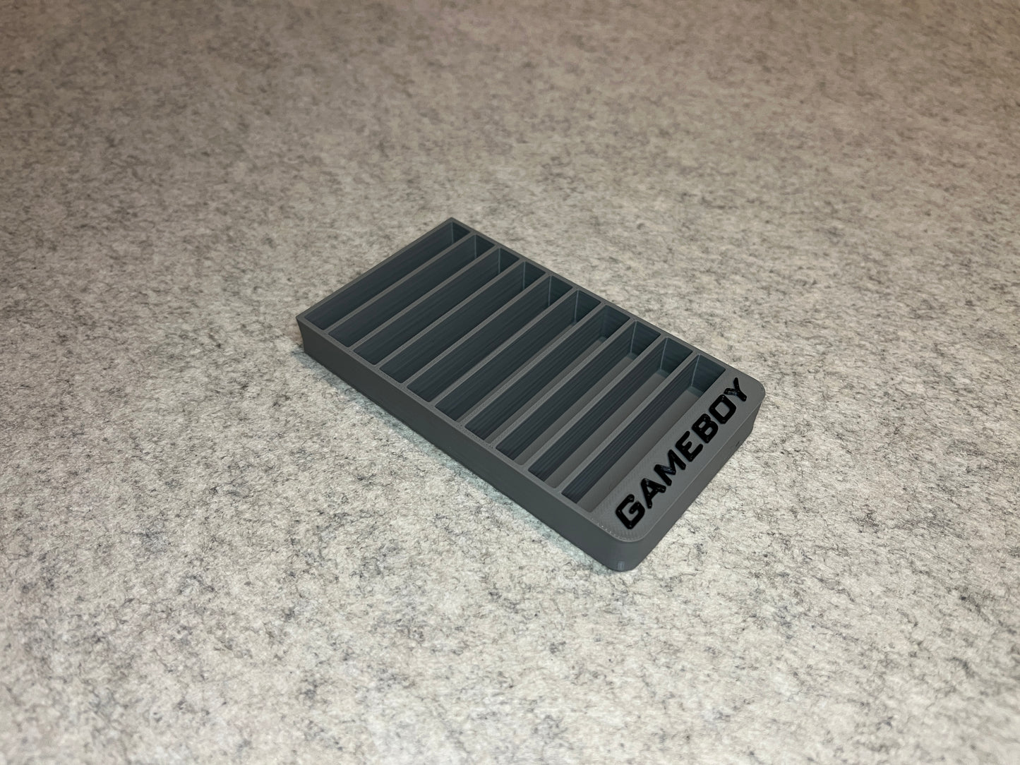 Spelställ för 10 GameBoy cartridge med GAMEBOY text