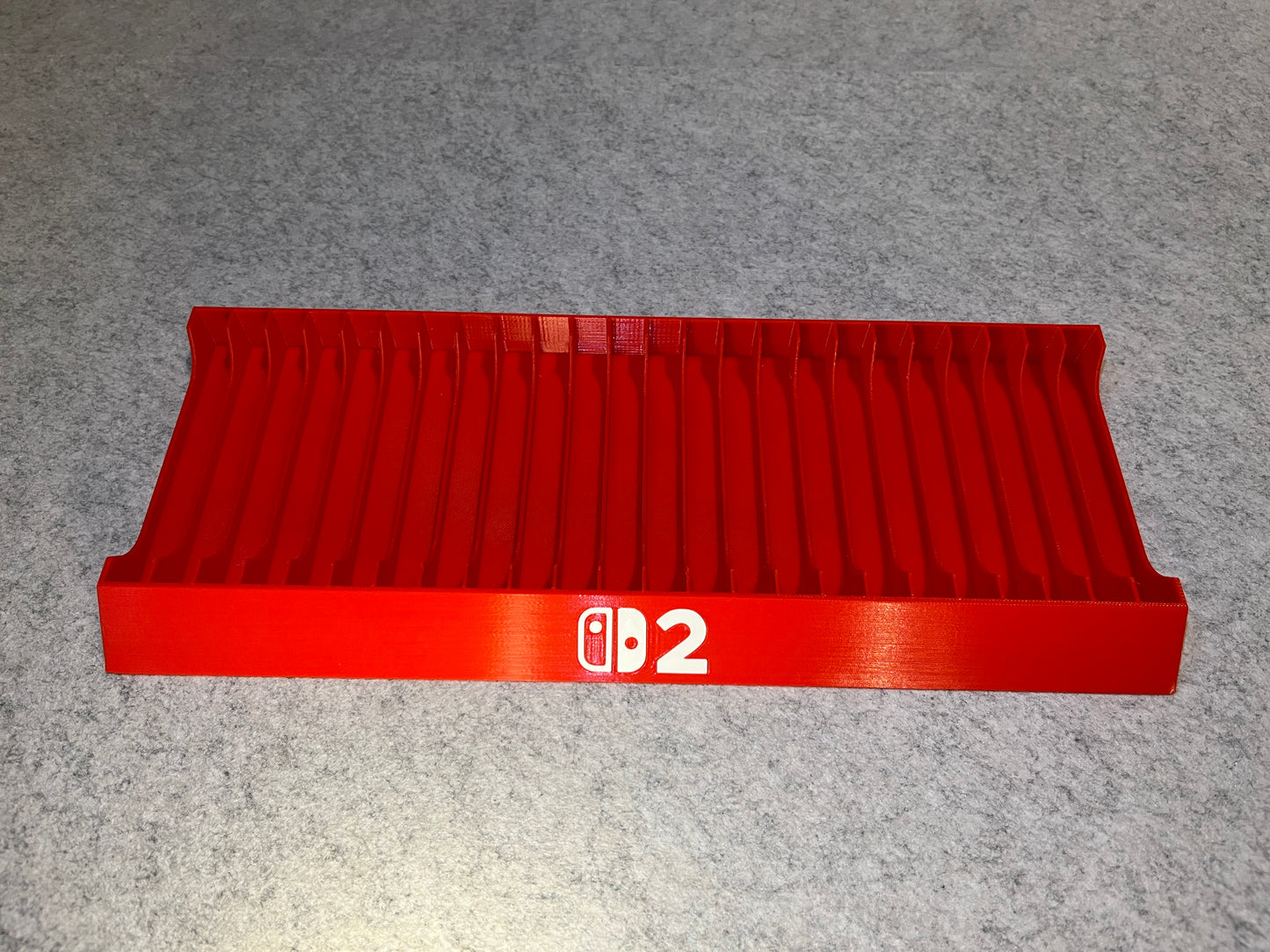 Spelställ för 24 Nintendo Switch 2-spel med NS2-loggan