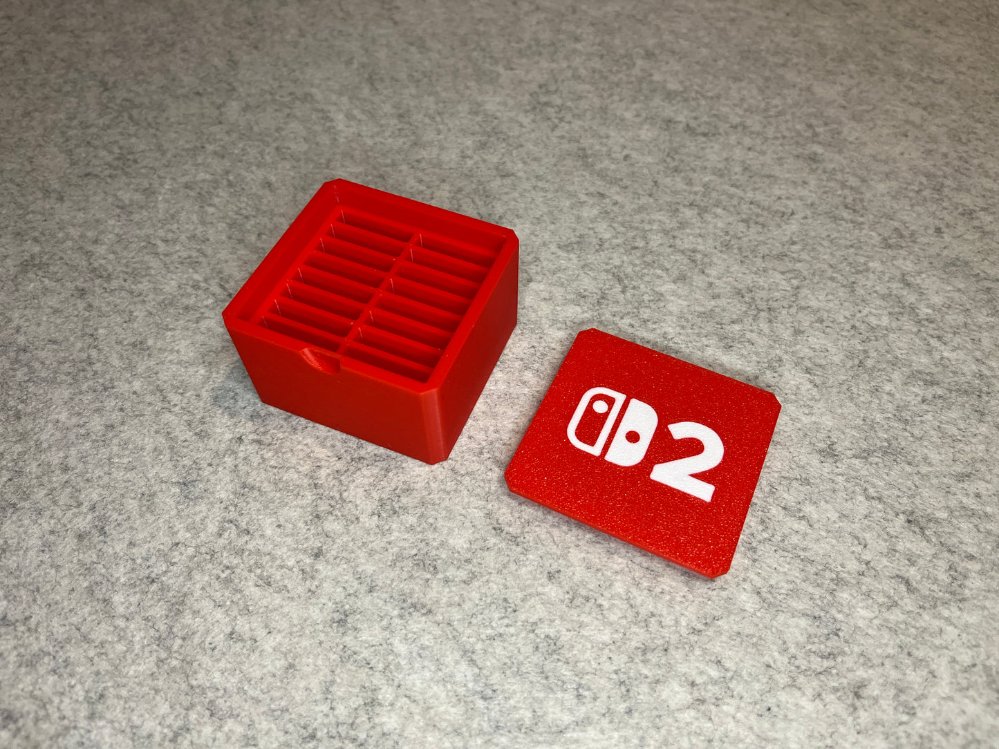 Spellåda för 16 Nintendo Switch 2-cartridge med lock