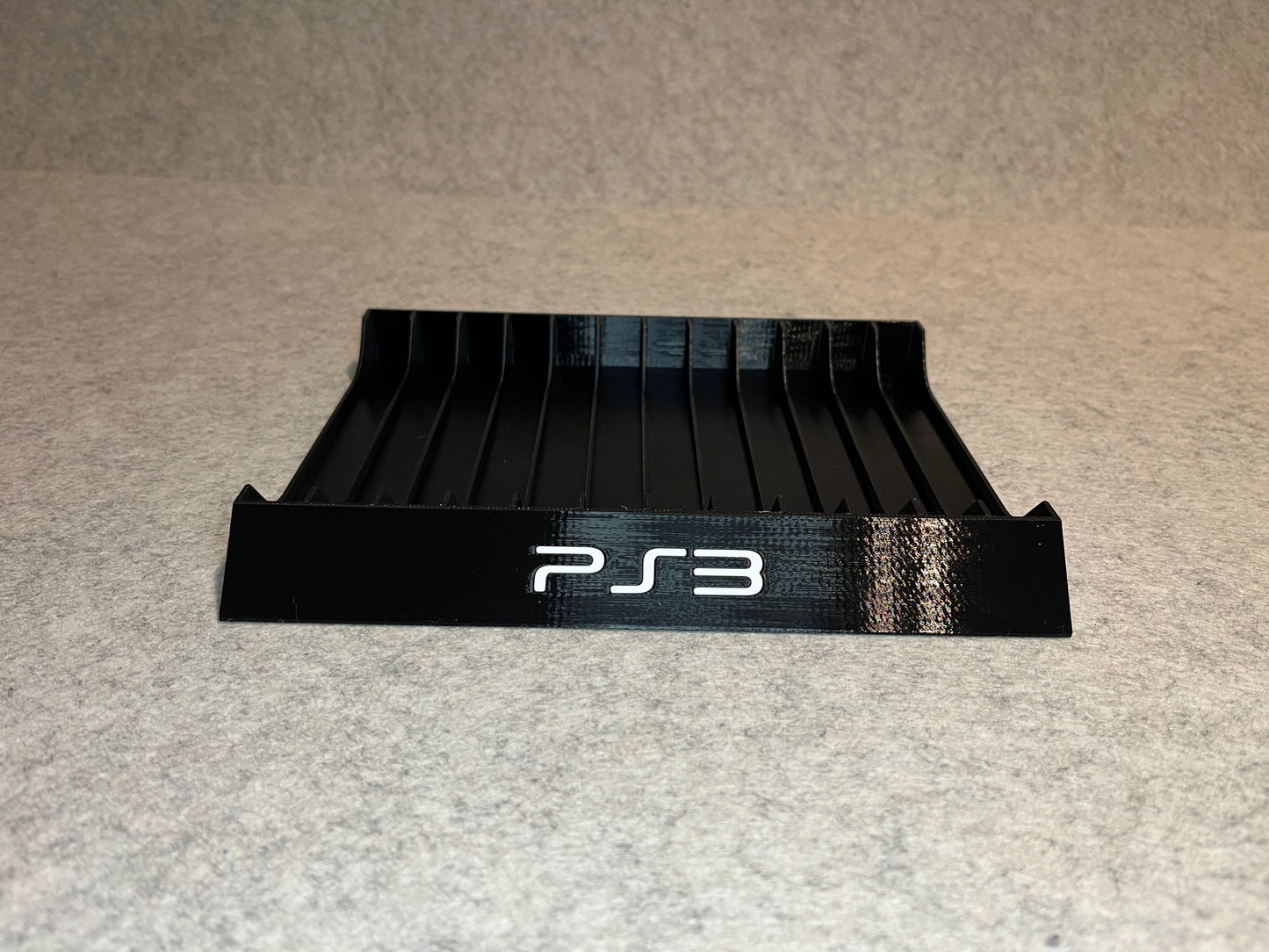 Spelställ för 12 PlayStation 3-spel med PS3-loggan