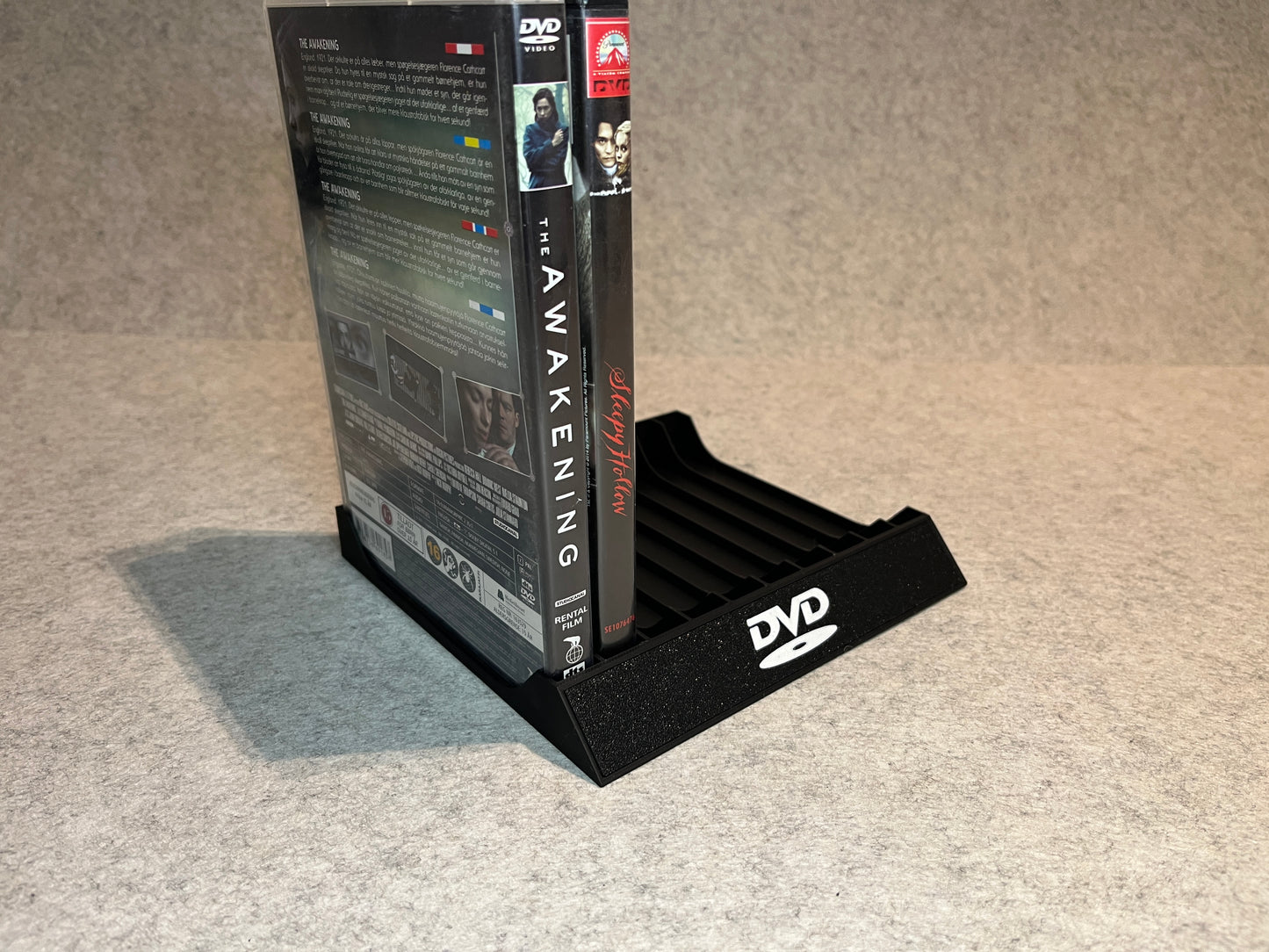 Ställ för 10 DVD-filmer med DVD-logotyp