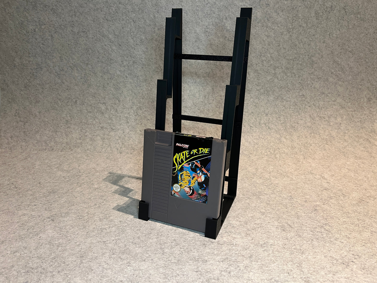 Display spelställ för 4 spel till Nintendo NES