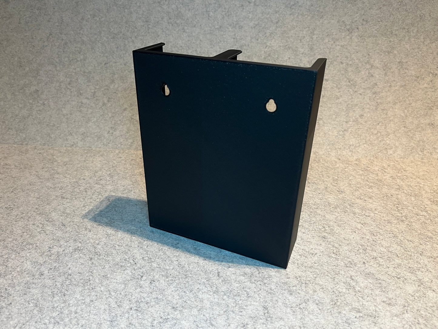 Vägghållare för 20 MiniDV kassettband