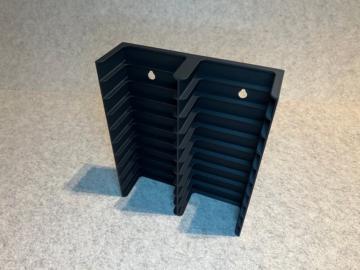 Vägghållare för 20 MiniDV kassettband