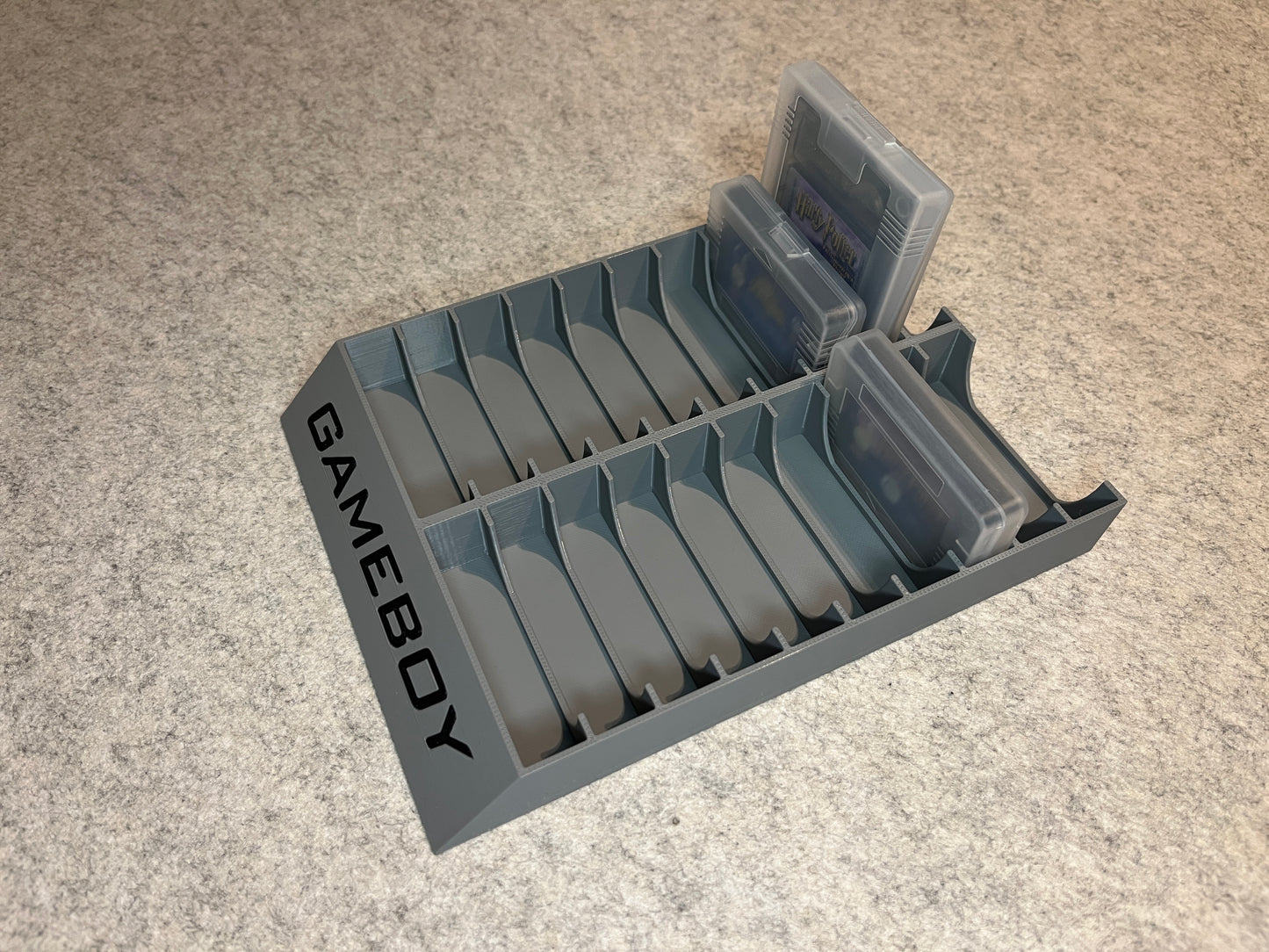 Spelställ för 20 GameBoy spel i skyddsfodral med GAMEBOY text