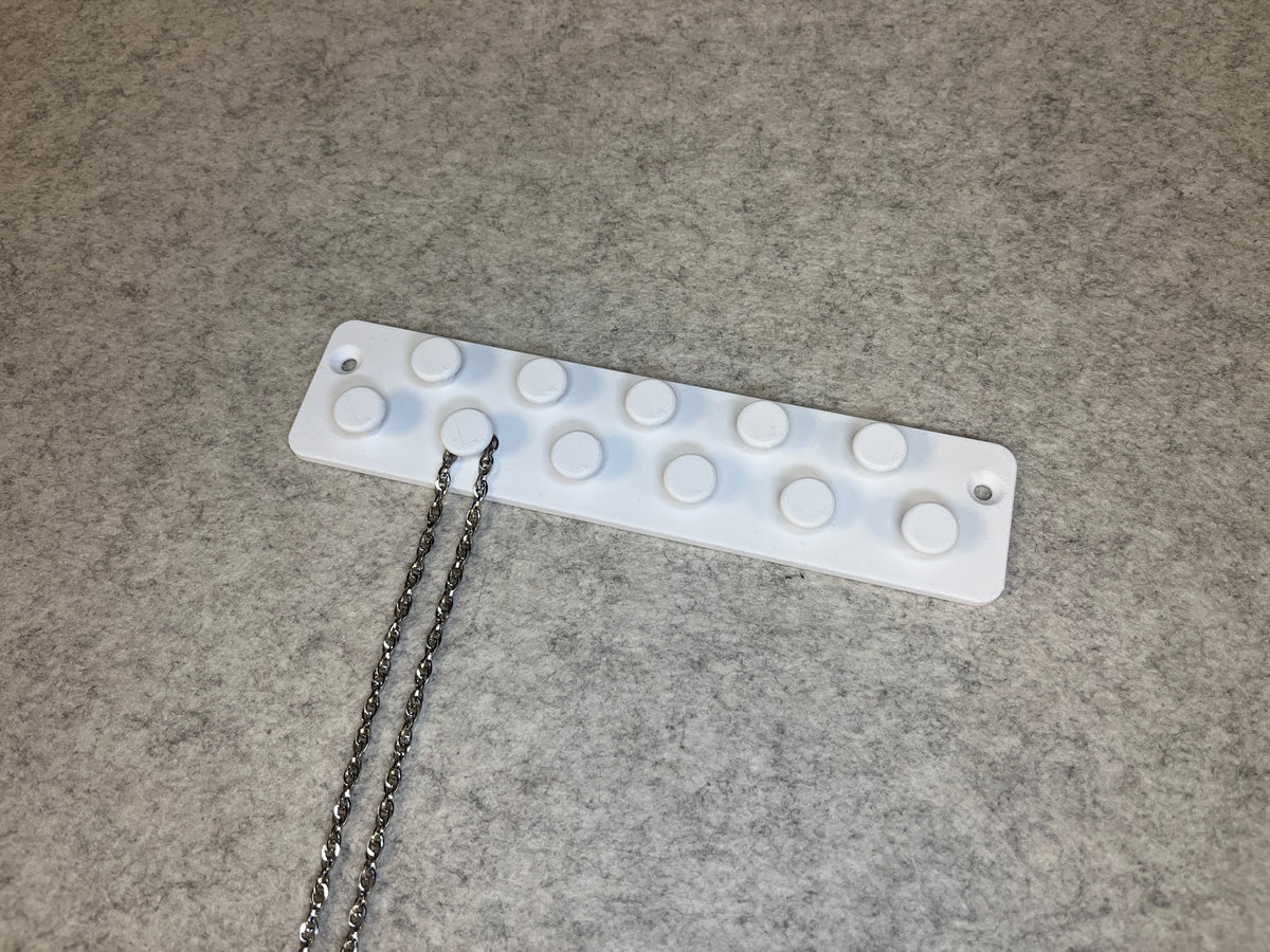 Vägghållare för halsband