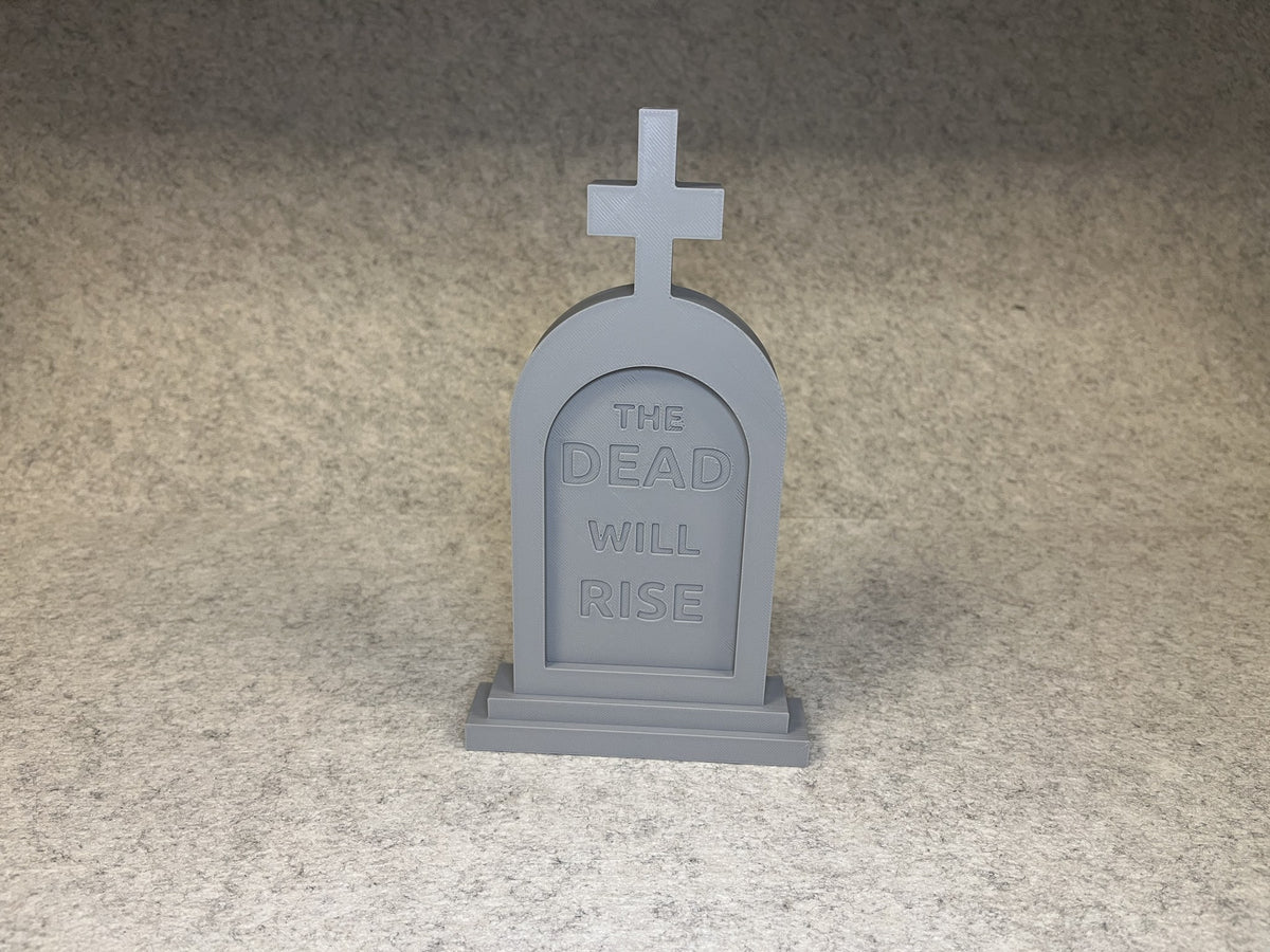 3D-printad Halloween gravsten med texten THE DEAD WILL RISE och kors på toppen