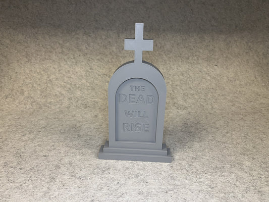 3D-printad Halloween gravsten med texten THE DEAD WILL RISE och kors på toppen